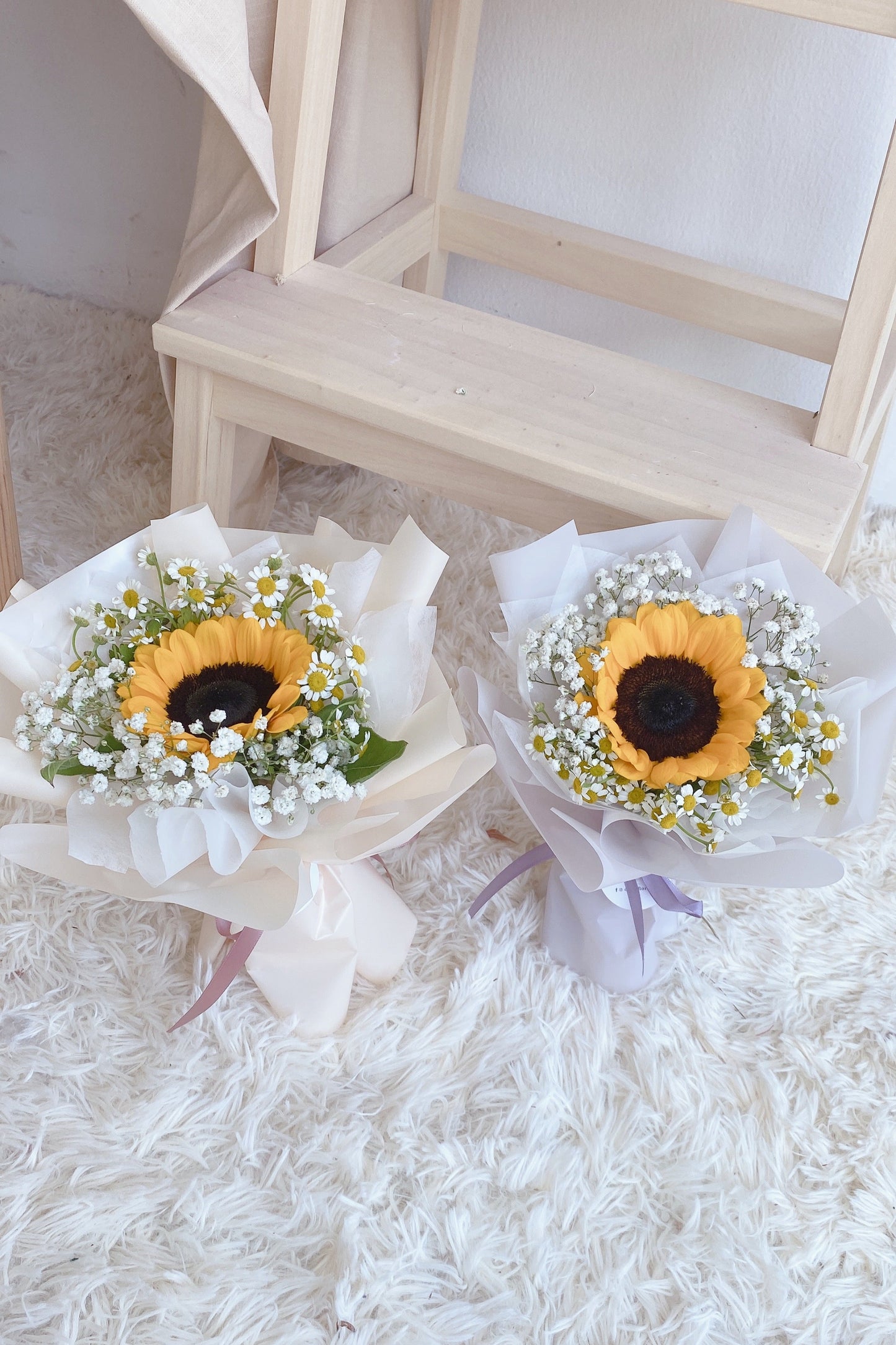 single stalk of sunflower with baby's breath